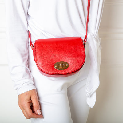 The Paris Leather Handbag in poppy red with a long, leather adjustable strap